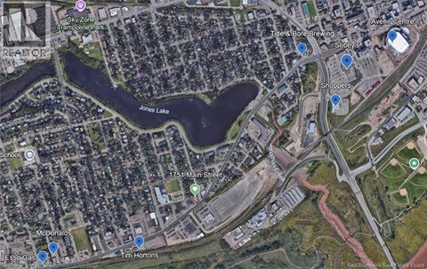 A satellite image of a city area with a lake, a McDonald's and a Tim Hortons.