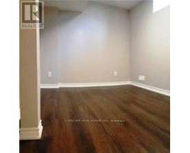 A room with wooden floors and white walls.