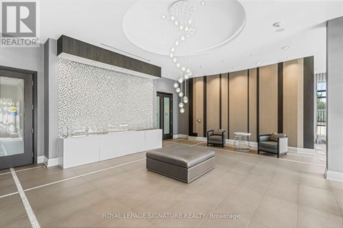 A spacious room with a bench, chairs, and a decorative chandelier.