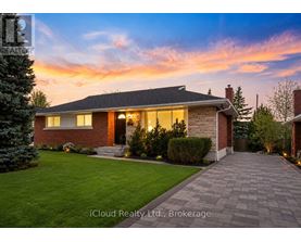 A house with a brick exterior and a stone pathway leading to the front door.