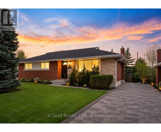 A house with a brick exterior and a stone pathway leading to the front door.