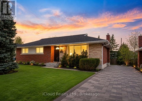 A house with a brick exterior and a stone pathway leading to the front door.