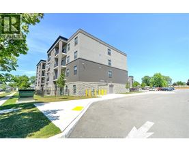 A building with a parking lot in front of it.