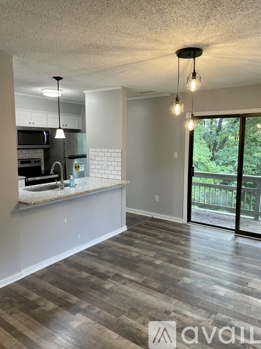 A kitchen with a marble countertop and a modern design.