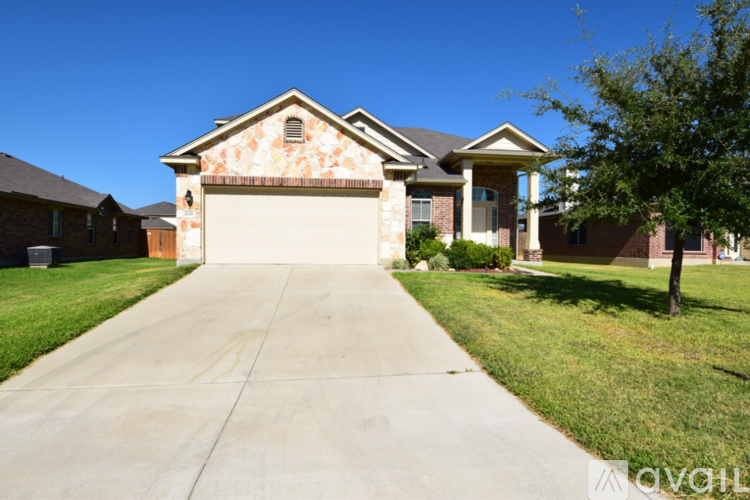 A house with a driveway in front of it.