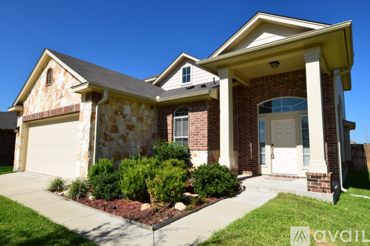 A house with a front yard and a garage.
