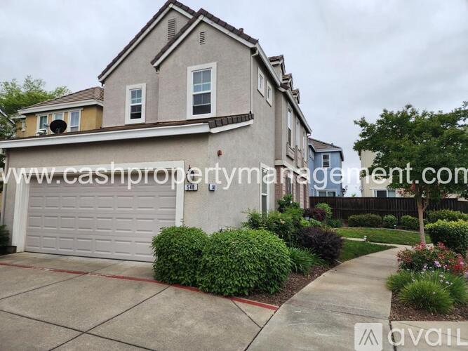 A house with a white garage door is for sale.