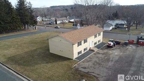 A large building with a parking lot in front of it.