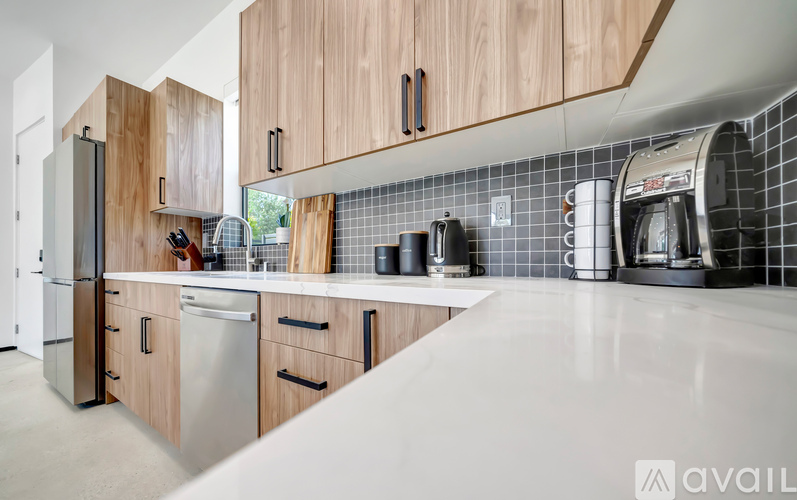 A kitchen with wooden cabinets and a white countertop.