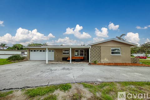 A two-story house with a garage is available for rent.