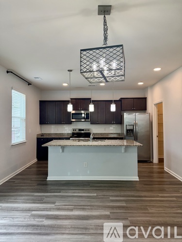 A modern kitchen with a large island in the middle.
