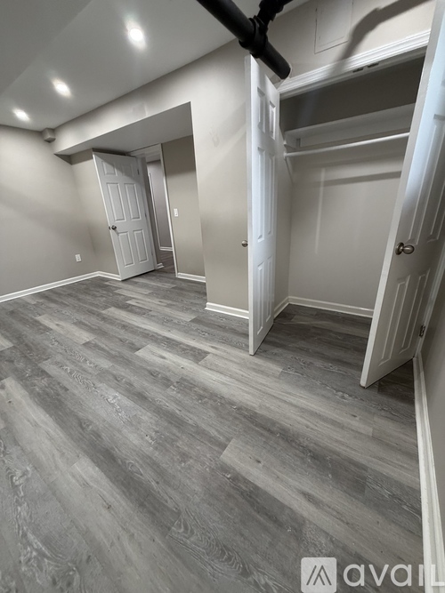 A room with a grey floor and white walls.