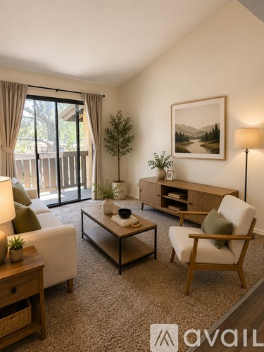 A living room with a white sofa, a wooden chair, a coffee table, and a painting on the wall.