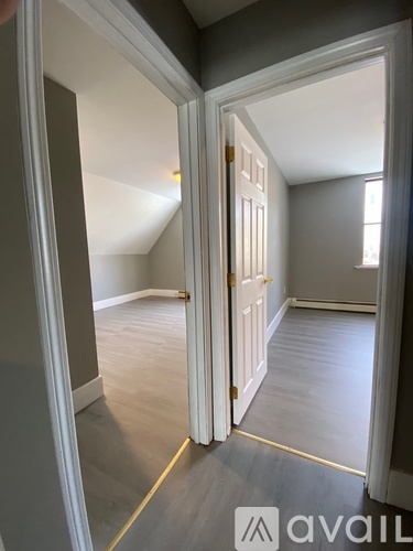 A room with a doorway leading to another room.