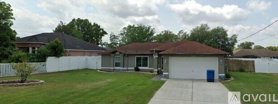 A house with a white garage door is for sale.