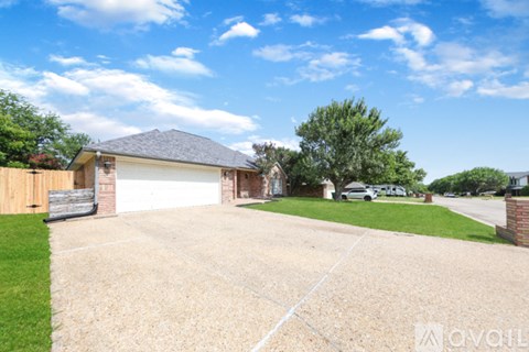 A house with a driveway in front of it is for sale.
