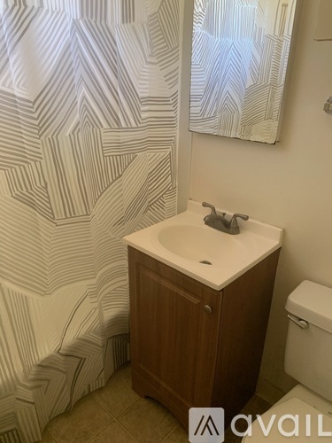 A bathroom with a sink and toilet.