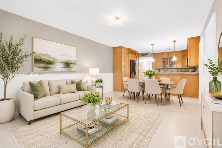 A modern living room with a glass coffee table and a large painting on the wall.