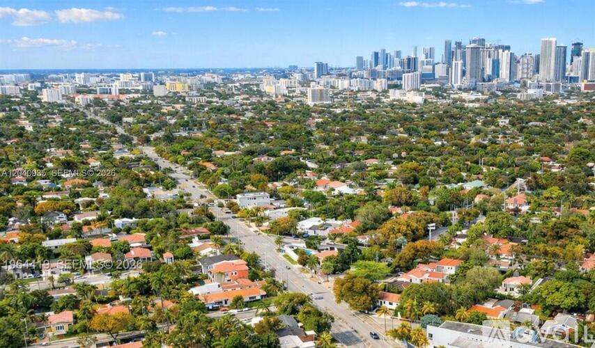 A cityscape with a mix of residential and commercial buildings.