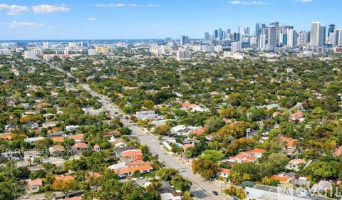 A cityscape with a mix of residential and commercial buildings.