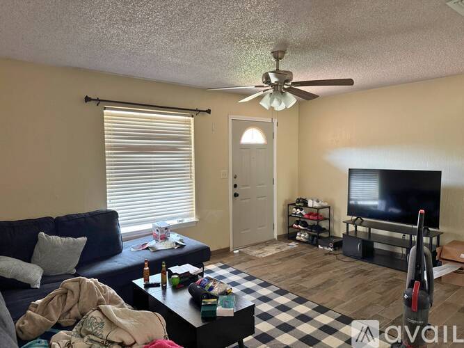 A living room with a black and white checkered floor.