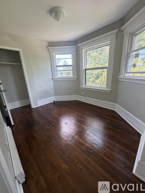 A room with wooden floors and white walls.