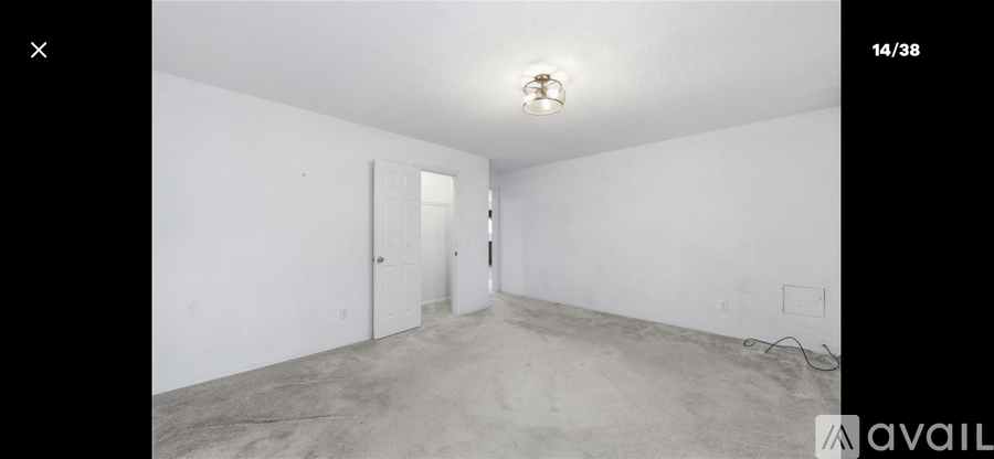 A room with white walls and a concrete floor.