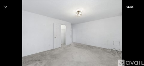 A room with white walls and a concrete floor.