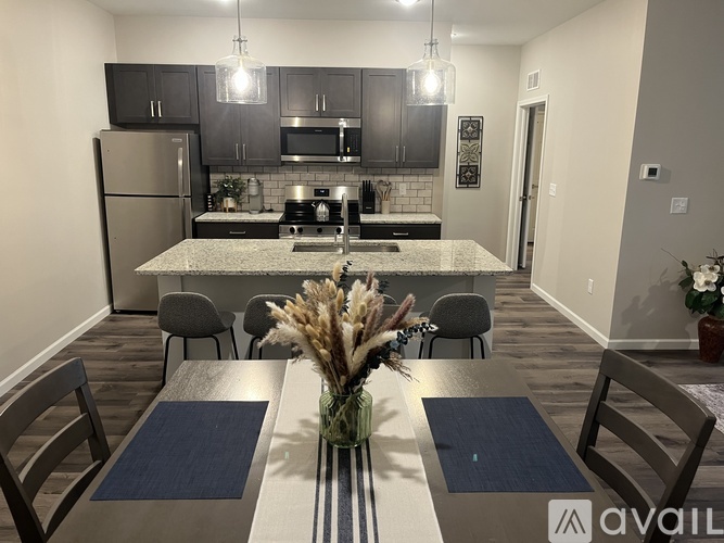 A kitchen with a dining table set for four.