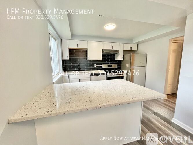 A kitchen with a granite countertop and a price tag of $529,547.