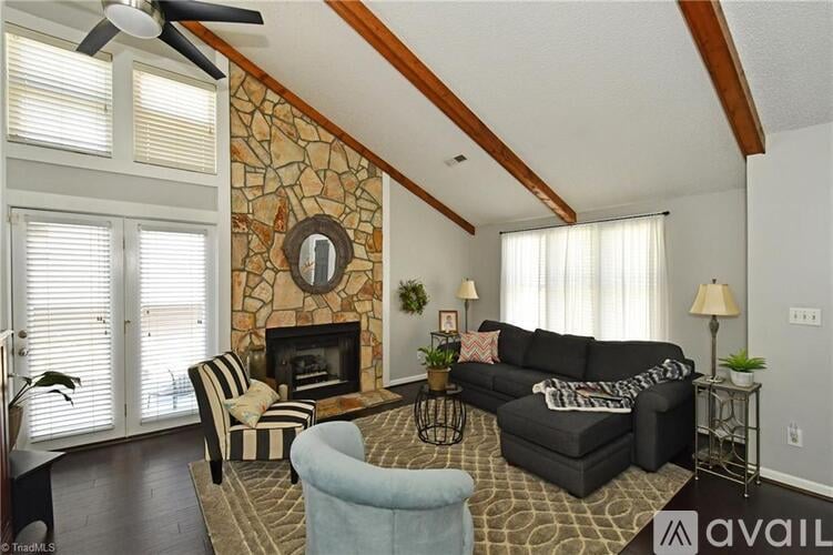 A living room with a fireplace and a couch.