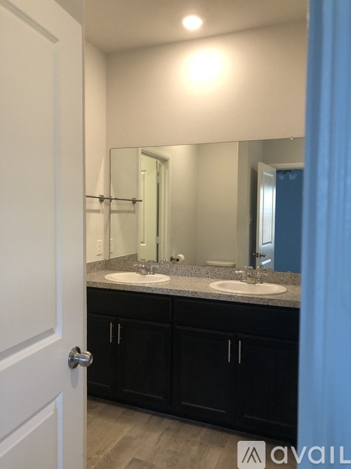 A bathroom with a sink and mirror.