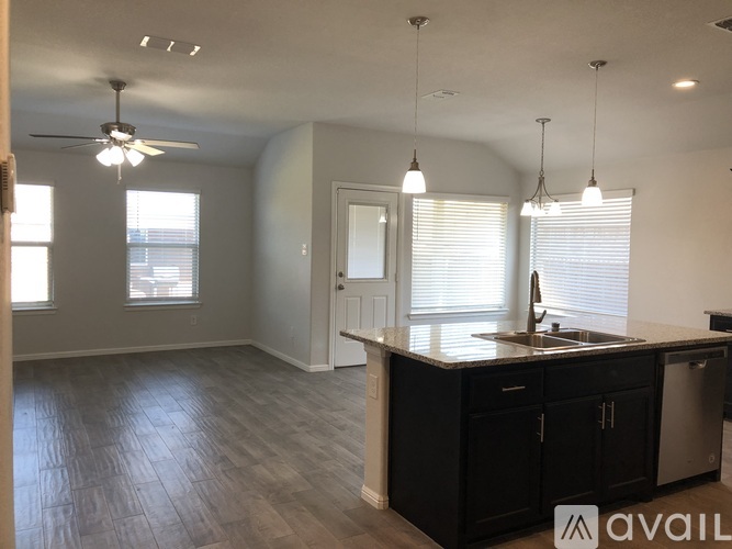 A kitchen with a counter and cabinets.