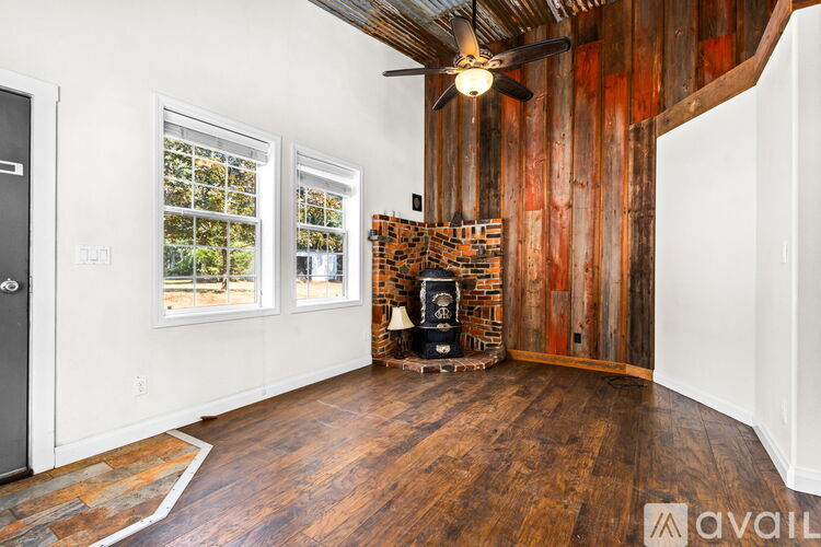 A room with a wood floor and a wood wall.