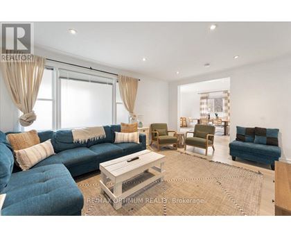 A living room with a blue couch and a coffee table.