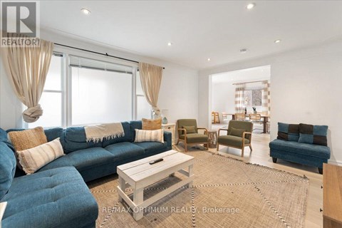 A living room with a blue couch and a coffee table.