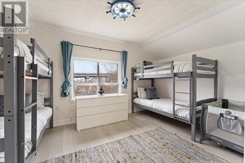A bedroom with bunk beds and a window.