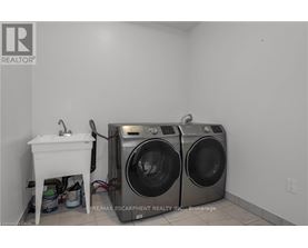 A laundry room with a washer and dryer.