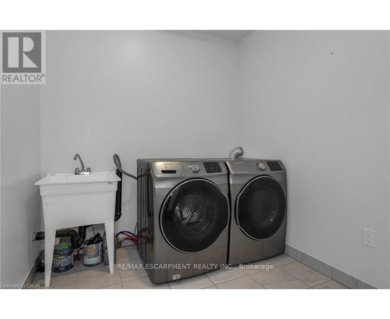A laundry room with a washer and dryer.
