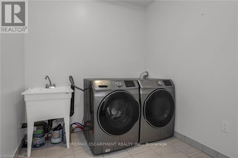 A laundry room with a washer and dryer.