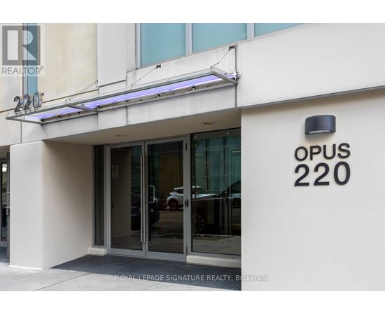 The entrance to a building with the sign OPUS 220.