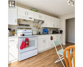 A room with a desk and a chair.