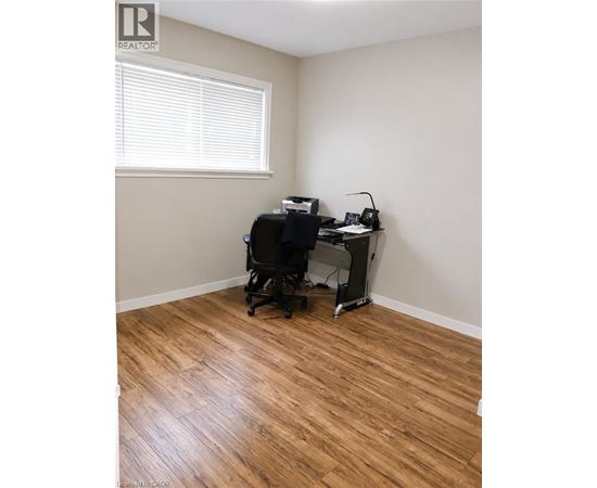 A room with a desk and a chair.