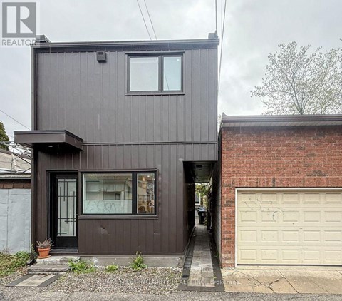 A modern house with a garage door.