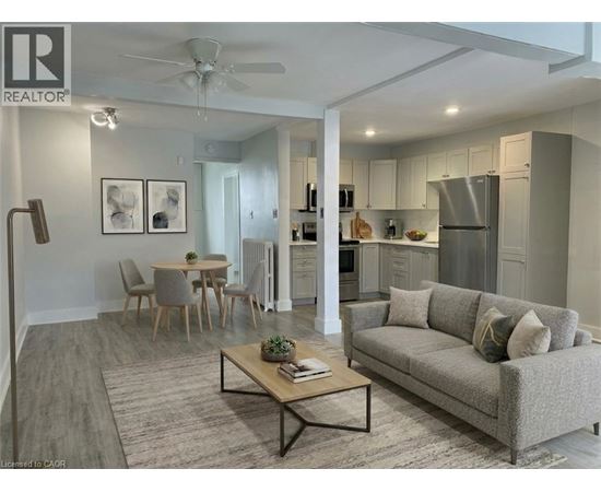 A well-lit, modern living room with a grey sofa and a coffee table.