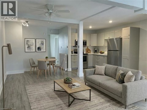 A well-lit, modern living room with a grey sofa and a coffee table.