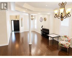 A living room with a piano and a chair.