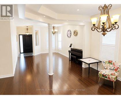 A living room with a piano and a chair.