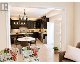 A modern kitchen with a dining table set up.