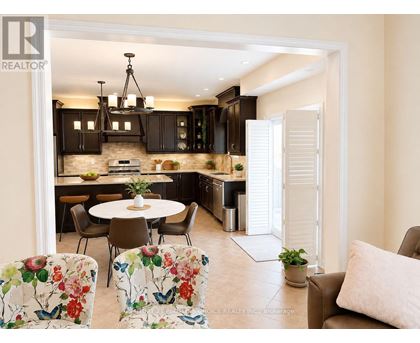 A modern kitchen with a dining table set up.